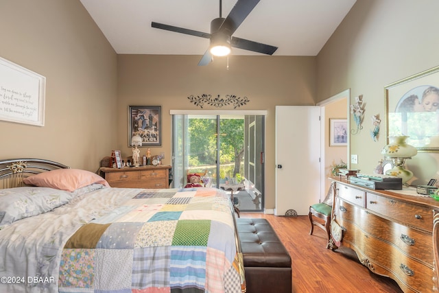 bedroom featuring access to exterior, wood-type flooring, and ceiling fan