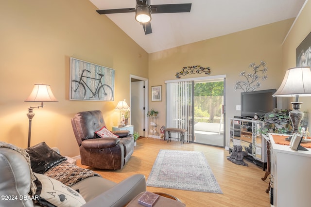 living room with high vaulted ceiling, ceiling fan, and light hardwood / wood-style floors