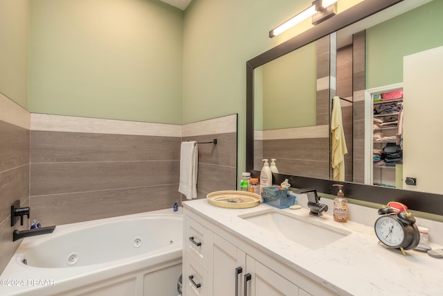 bathroom featuring vanity and a tub