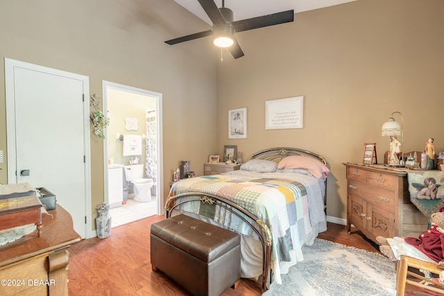 bedroom with ceiling fan, light hardwood / wood-style floors, and ensuite bath