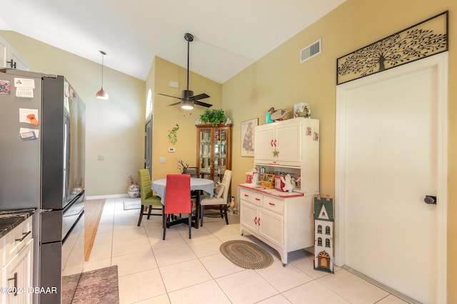 3836 Long Grove Ln, Port Orange, FL 32129 - dining space featuring ceiling fan, light tile patterned flooring, and high vaulted ceiling