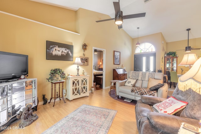 living room with high vaulted ceiling, hardwood / wood-style floors, and ceiling fan