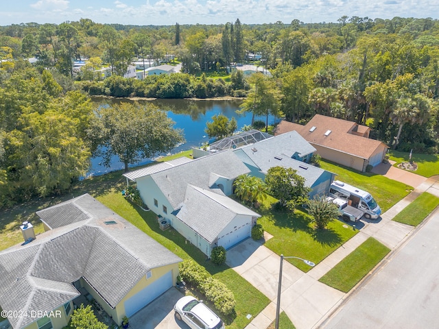 birds eye view of property with a water view