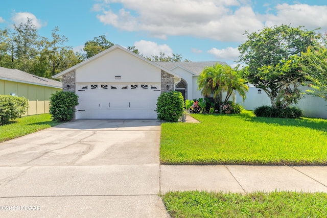 ranch-style home with a garage and a front yard