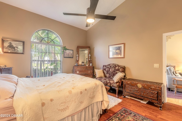 bedroom with hardwood / wood-style floors, ceiling fan, and lofted ceiling