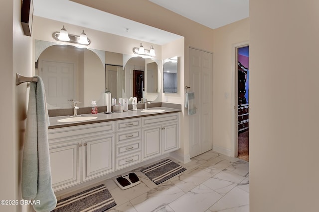 4670 Links Village Dr Unit B706, Ponce Inlet, FL 32127 - full bath with marble finish floor, double vanity, a sink, and baseboards