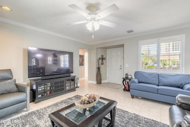 living room with crown molding, a textured ceiling, and light tile patterned flooring