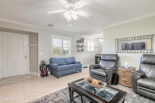 living room featuring light tile patterned floors, ornamental molding, a textured ceiling, and ceiling fan