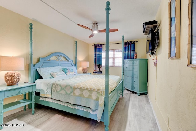 bedroom featuring ceiling fan and hardwood / wood-style flooring