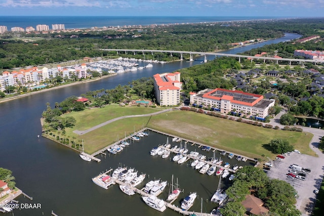 birds eye view of property with a water view