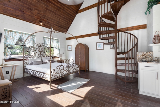 bedroom with high vaulted ceiling, dark hardwood / wood-style floors, and wooden ceiling