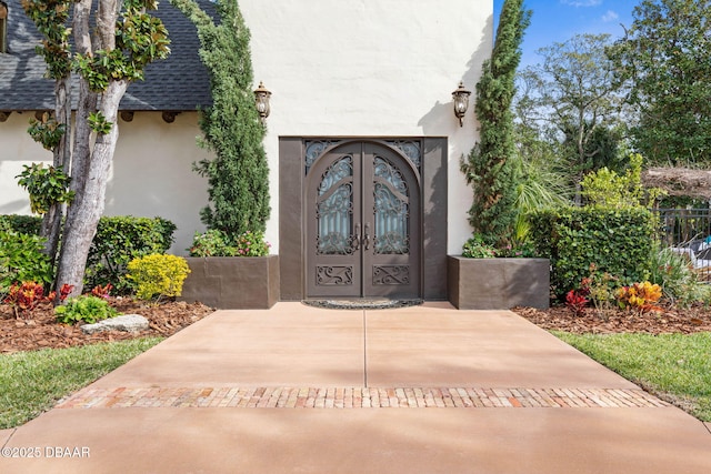 property entrance featuring french doors