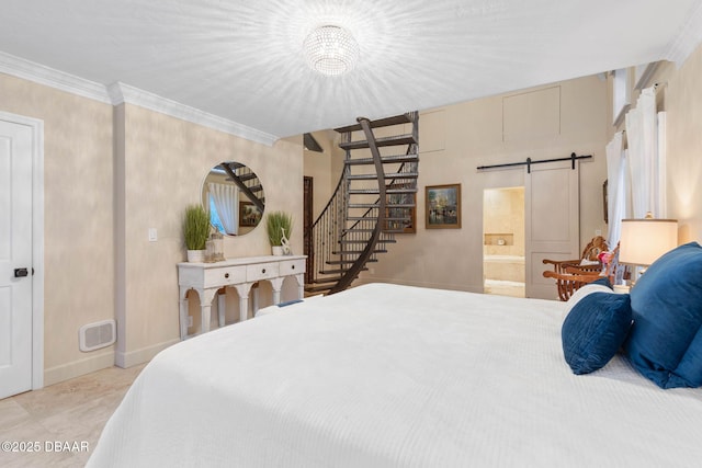 bedroom featuring ornamental molding, ensuite bathroom, a barn door, and a notable chandelier