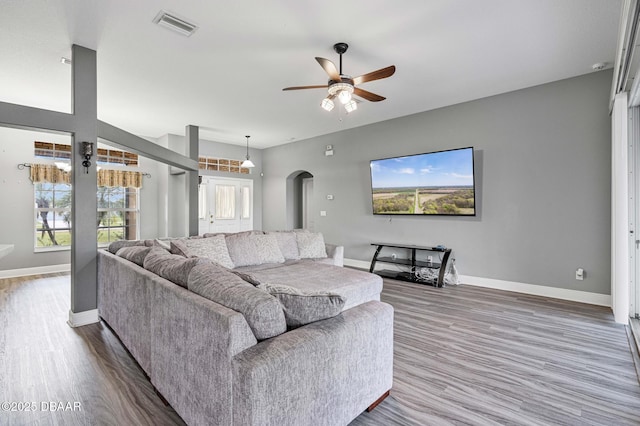 living room with hardwood / wood-style floors and ceiling fan