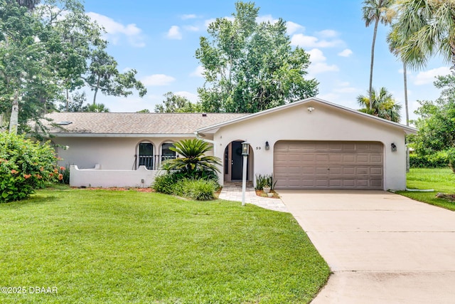 59 Blakeport Ln, Palm Coast, FL 32137 - single story home featuring stucco siding, concrete driveway, a front lawn, and a garage