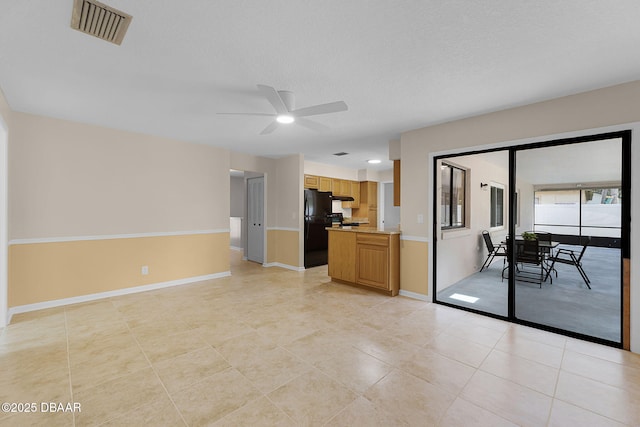 59 Blakeport Ln, Palm Coast, FL 32137 - unfurnished living room featuring a ceiling fan and light tile patterned floors