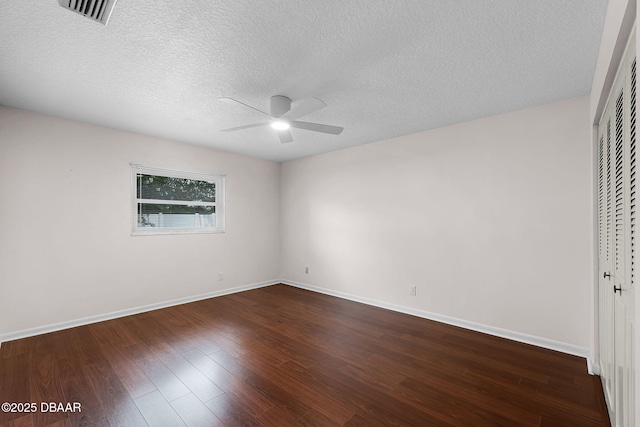 59 Blakeport Ln, Palm Coast, FL 32137 - unfurnished bedroom with dark wood-style flooring, a closet, a textured ceiling, and a ceiling fan