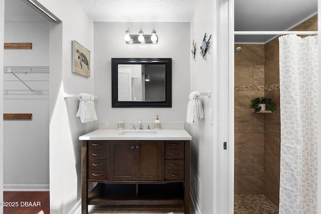 59 Blakeport Ln, Palm Coast, FL 32137 - bathroom featuring vanity, a tile shower, and wood finished floors
