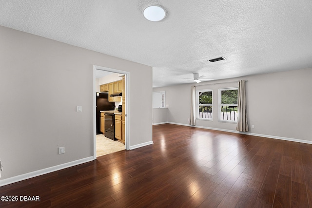 59 Blakeport Ln, Palm Coast, FL 32137 - unfurnished living room featuring ceiling fan, hardwood / wood-style flooring, and a textured ceiling