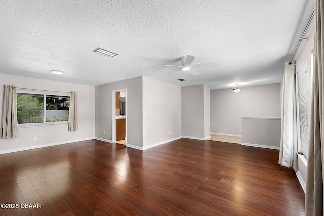 59 Blakeport Ln, Palm Coast, FL 32137 - unfurnished room with a ceiling fan, a textured ceiling, and dark wood-type flooring