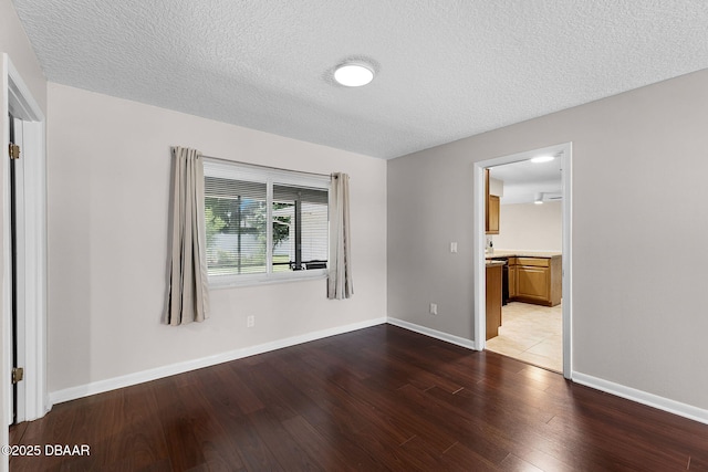 59 Blakeport Ln, Palm Coast, FL 32137 - empty room featuring wood finished floors and a textured ceiling