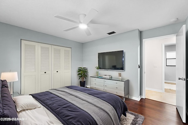 59 Blakeport Ln, Palm Coast, FL 32137 - bedroom with dark wood-type flooring, a closet, and ceiling fan