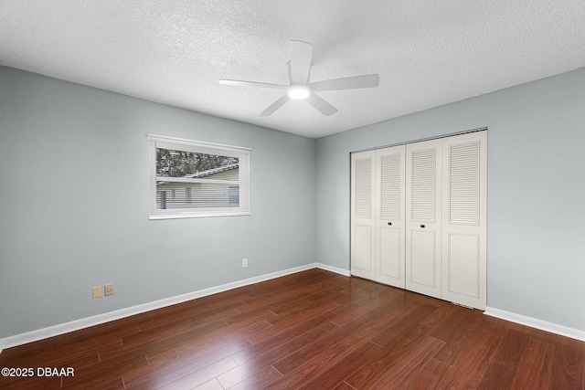 59 Blakeport Ln, Palm Coast, FL 32137 - unfurnished bedroom with wood finished floors, a closet, a textured ceiling, and a ceiling fan