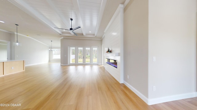 unfurnished living room with beamed ceiling, ceiling fan, light wood-type flooring, and crown molding