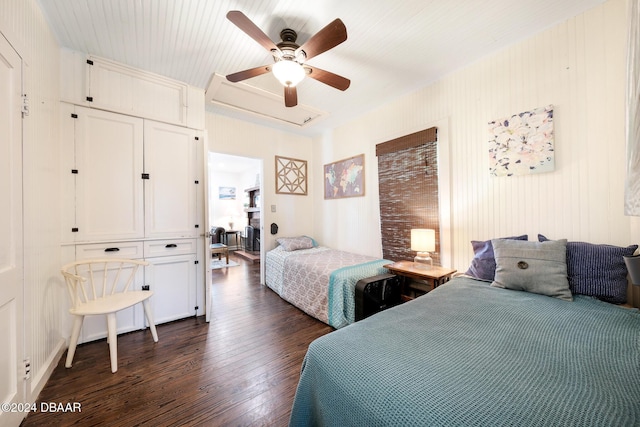 bedroom with ceiling fan and dark hardwood / wood-style floors