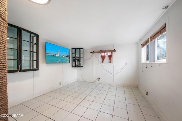 unfurnished room featuring light tile patterned floors