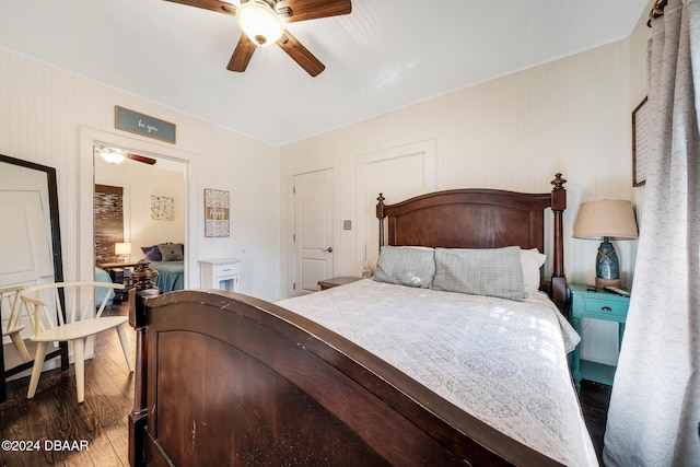 bedroom featuring ceiling fan and dark hardwood / wood-style floors