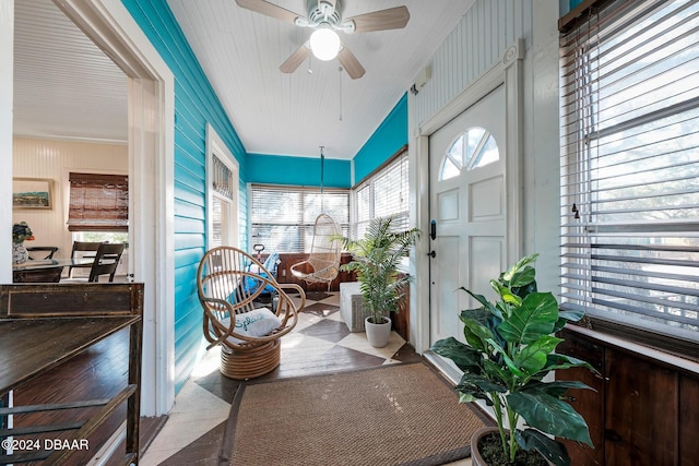 sunroom featuring ceiling fan