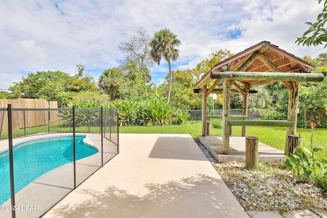 view of pool with a gazebo, a patio, and a lawn