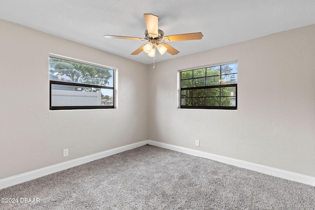 unfurnished room featuring carpet flooring and ceiling fan