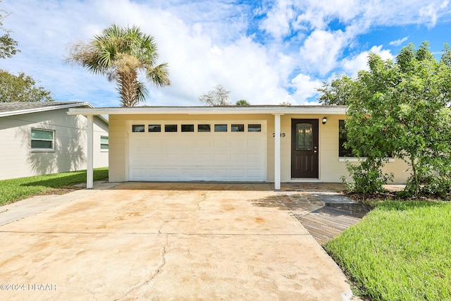 single story home featuring a garage