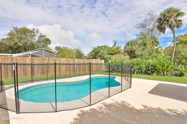 view of swimming pool with a patio