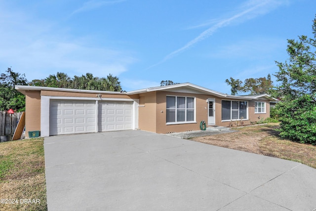 single story home featuring a garage