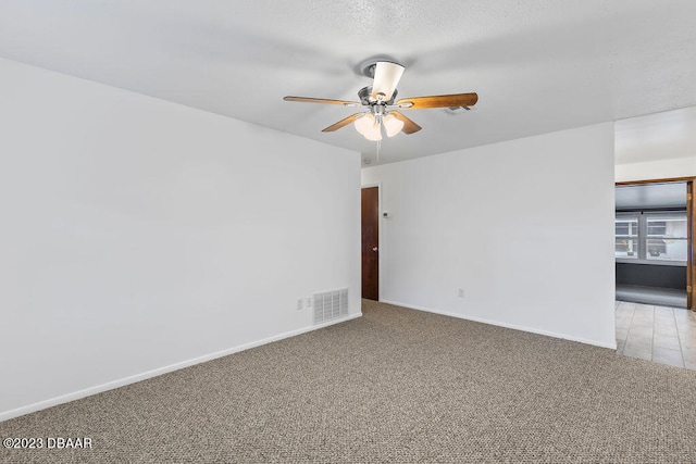 empty room with light carpet and ceiling fan