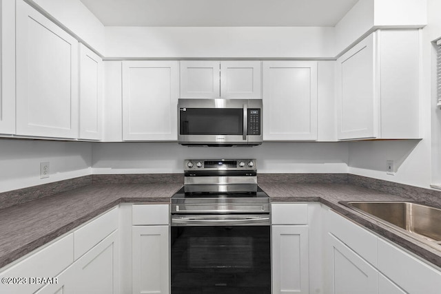 kitchen featuring white cabinetry, sink, and stainless steel appliances