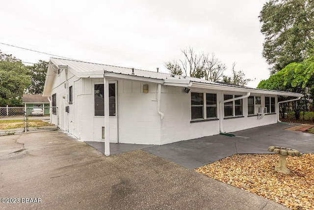 exterior space featuring cooling unit and a patio