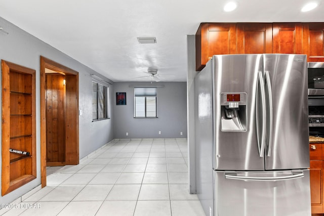 kitchen with a ceiling fan, visible vents, stainless steel fridge with ice dispenser, and light tile patterned floors