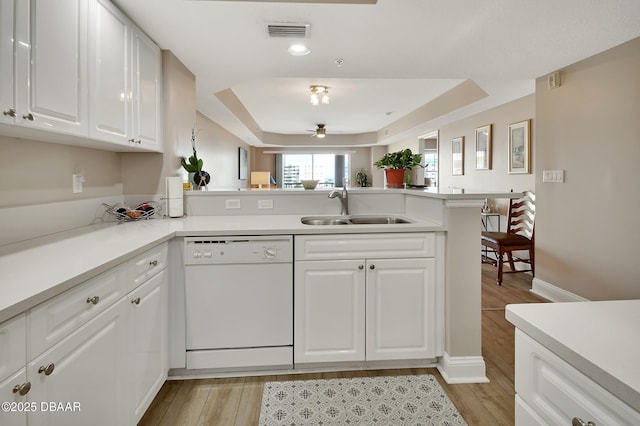 4670 Links Village Dr Unit A506, Ponce Inlet, FL 32127 - kitchen with visible vents, a peninsula, white dishwasher, light countertops, and a sink
