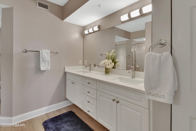 4670 Links Village Dr Unit A506, Ponce Inlet, FL 32127 - full bath featuring double vanity, a shower stall, visible vents, and a sink
