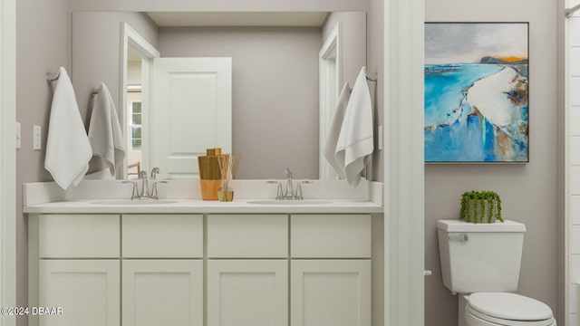 bathroom with toilet and vanity