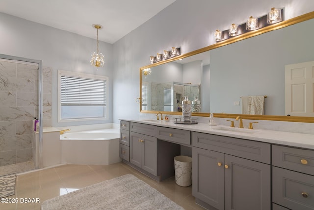 full bathroom featuring a bath, a sink, tile patterned flooring, and a stall shower