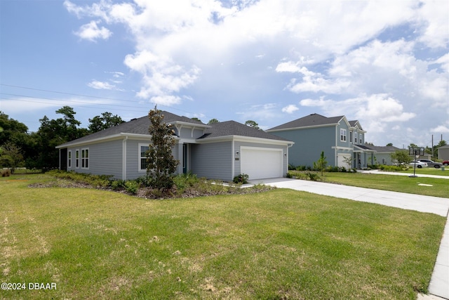 ranch-style home with a garage and a front yard