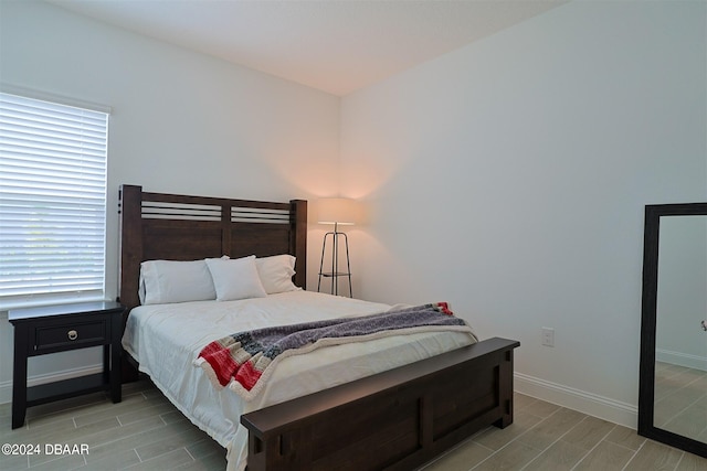 bedroom with light hardwood / wood-style flooring