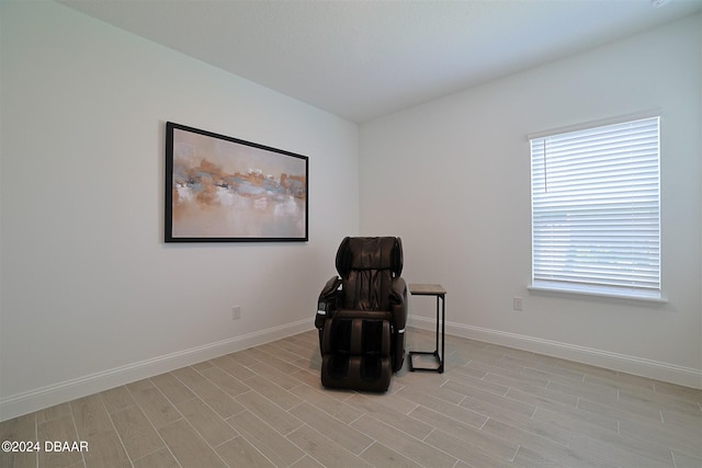 sitting room featuring light hardwood / wood-style floors