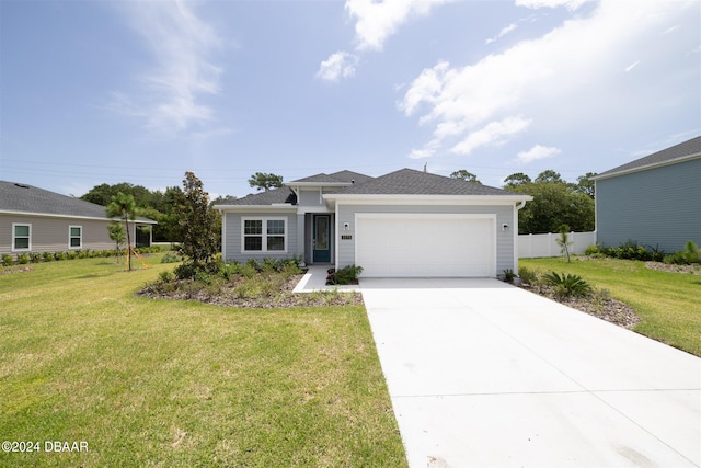 view of front facade with a garage and a front lawn