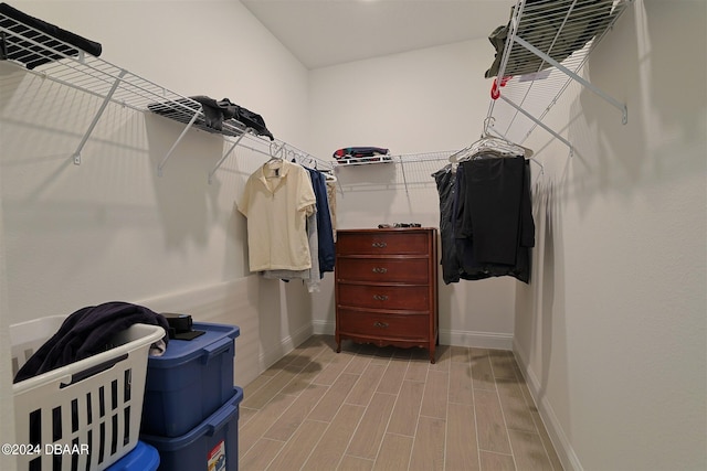 spacious closet with light hardwood / wood-style floors